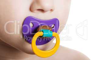 Child with baby pacifier