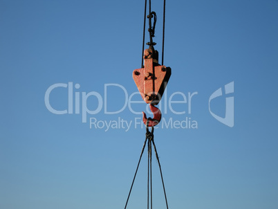 Hook of building crane lifting cargo
