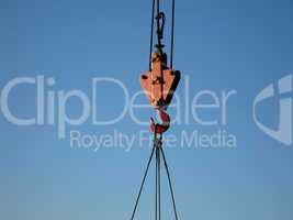 Hook of building crane lifting cargo
