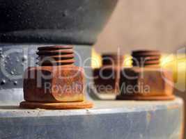 Old rusty metal nut on iron water valve
