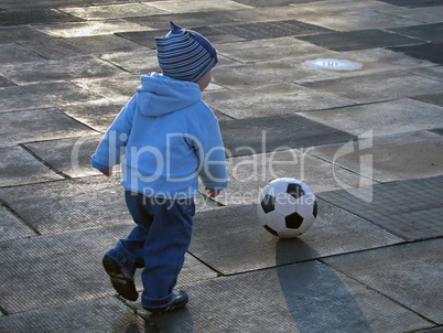 Child playing soccer