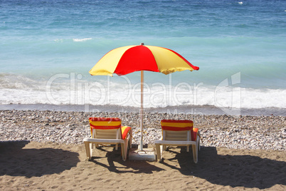 Beach chairs and umbrella