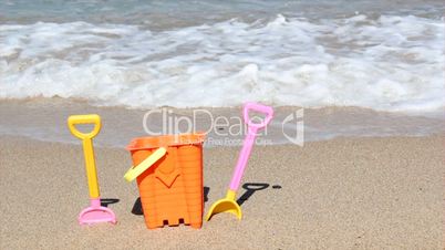 child's bucket and spade on beach