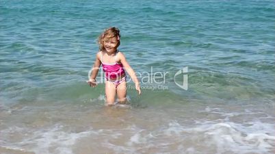 little girl splash water and fun