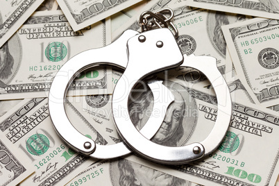 Handcuffs on dollar currency