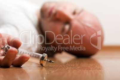 Addict injecting syringe
