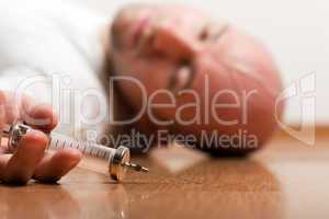 Addict injecting syringe