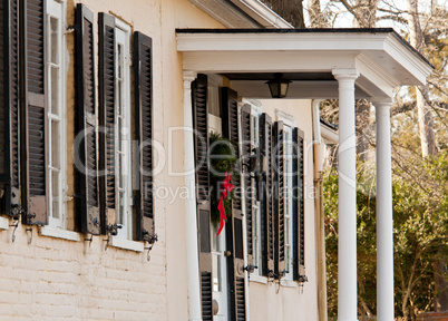 Cream colored house with xmas wreath