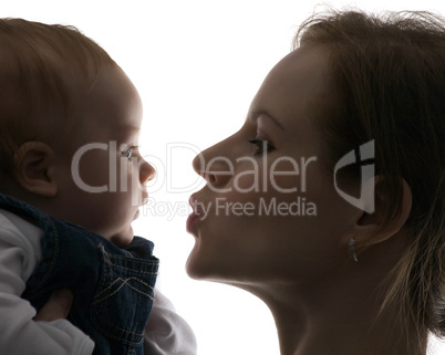 mum kisses toddler