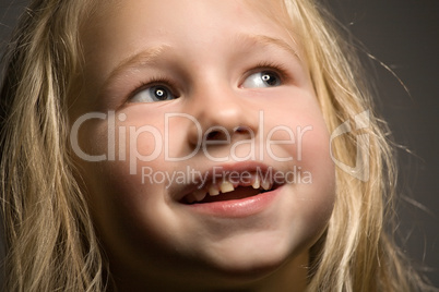little girl without one front tooth