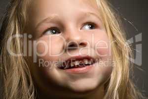 little girl without one front tooth