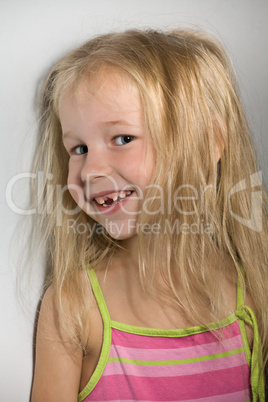 little girl without one front tooth