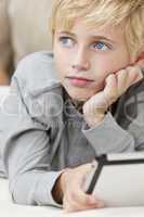 Blond Hair Blue Eyes Boy Child Using Tablet Computer