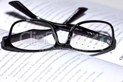 eyeglasses lie on the book