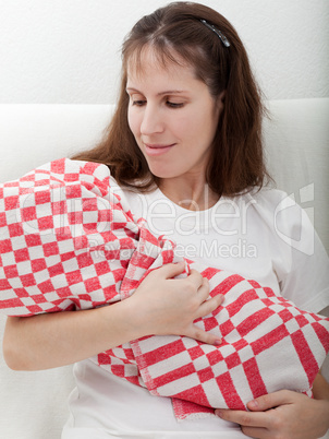 Mother holding newborn baby