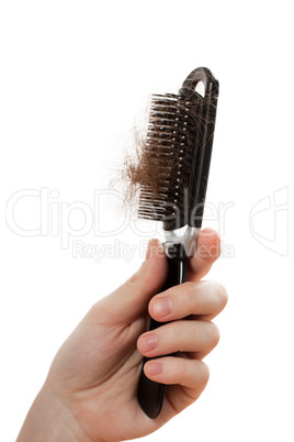 Loss hair comb in women hand