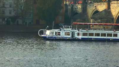 Pleasure boats move on vltava river in Prague