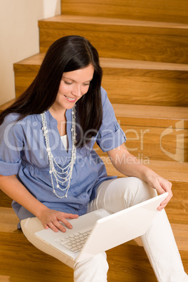 Home living happy woman work laptop staircase