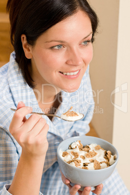 Home breakfast happy woman pajamas eating cereals