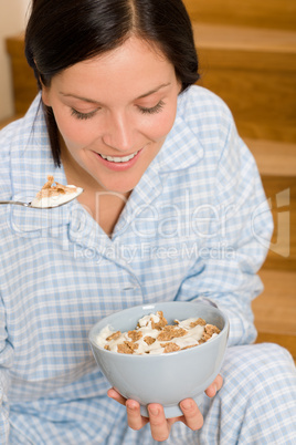 Home breakfast happy woman pajamas eating cereals