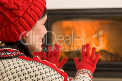 Fireplace warming up happy woman winter home