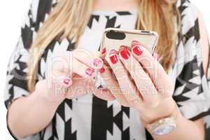 Close shot of woman hand holding a mobile phone typing a sms
