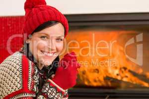 Fireplace warming up happy woman winter home