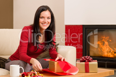 Christmas wrap present happy woman home fireplace