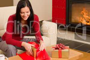 Christmas wrap present happy woman home fireplace