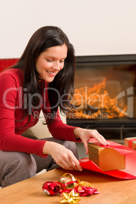 Christmas wrap present happy woman home fireplace