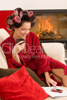 Home beauty woman with hair curlers drink