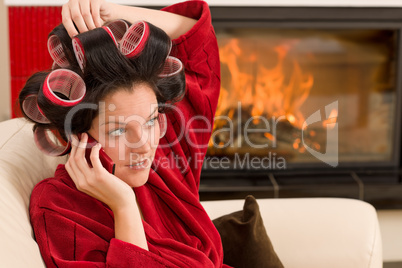 Home beauty woman with hair curlers calling