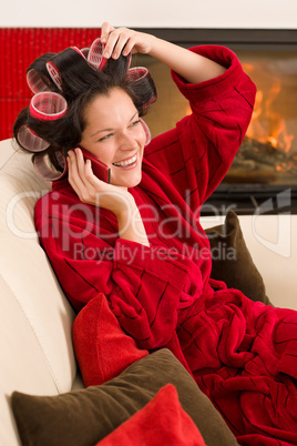 Home beauty woman with hair curlers calling