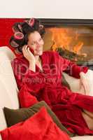 Home beauty woman with hair curlers calling