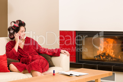 Home beauty woman with hair curlers calling