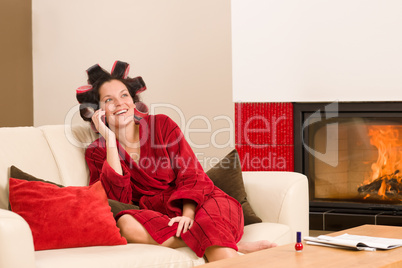 Home beauty woman with hair curlers calling