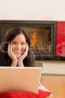 Home living happy woman work computer fireplace