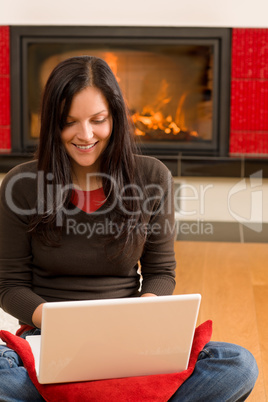 Home living happy woman work computer fireplace