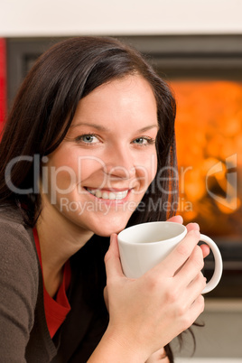 Winter home fireplace woman drink hot coffee