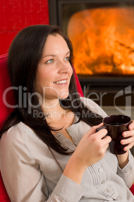 Winter home fireplace woman drink hot coffee