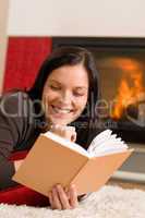 Home fireplace happy woman read book winter