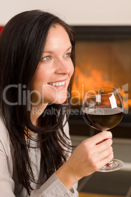 Winter home fireplace woman glass red wine