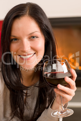 Winter home fireplace woman glass red wine