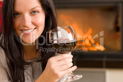 Winter home fireplace woman glass red wine