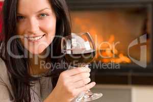 Winter home fireplace woman glass red wine