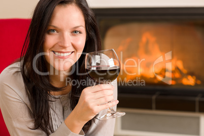 Winter home fireplace woman glass red wine