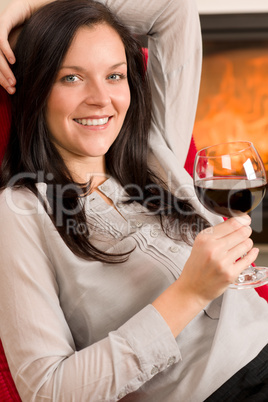 Winter home fireplace woman glass red wine Winter home fireplace woman glass red wine