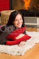 Home living happy woman lying by fireplace