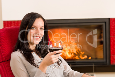 Winter home fireplace woman glass red wine