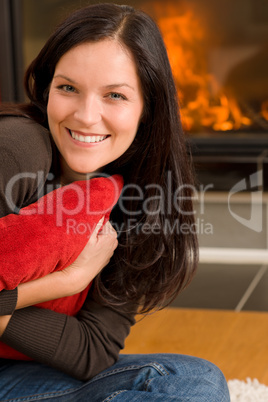Home fireplace happy woman hold cushion